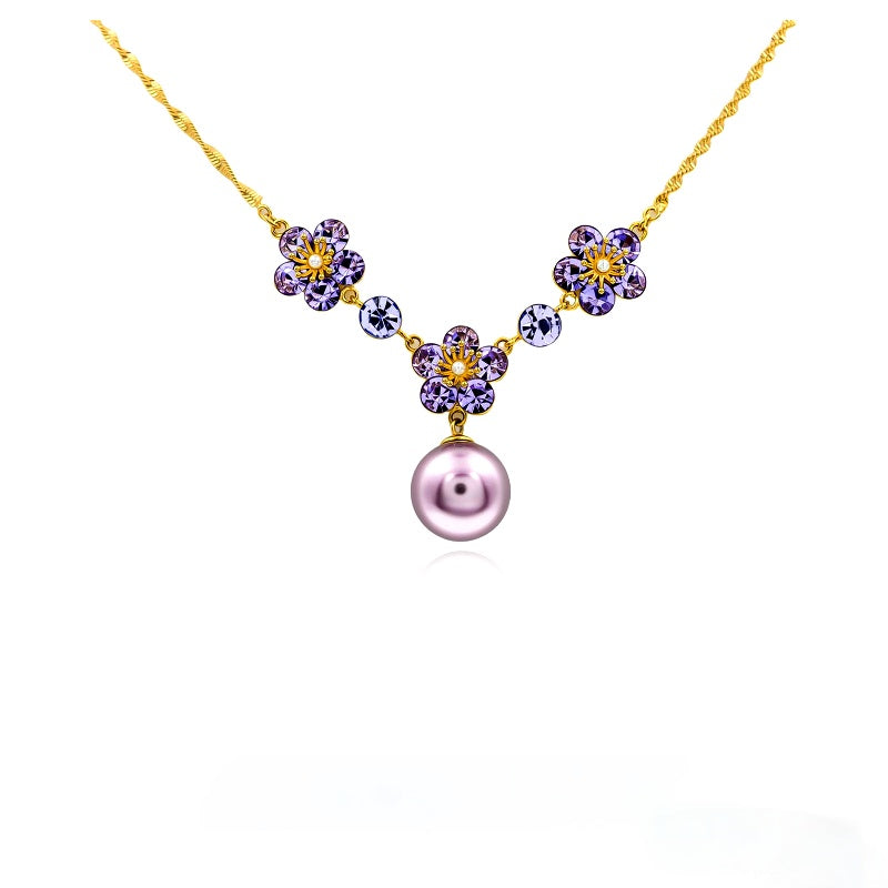 Collar flor de perlas en baño de oro 14 kilates